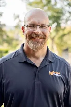 headshot of Tim