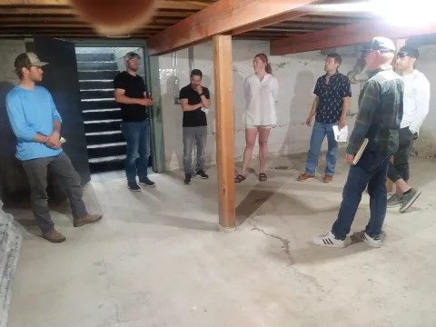 club in unfinished basement of commercial property tour